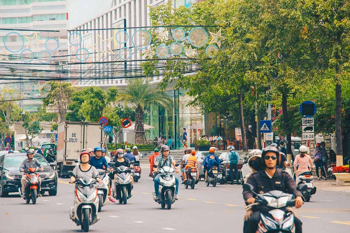 Nha Trang To Mui Ne: Travel By Bus, Train Or Private Transfer 8 one of the main roads in nha trang with motorbike traffic before driving from nha trang to mui ne