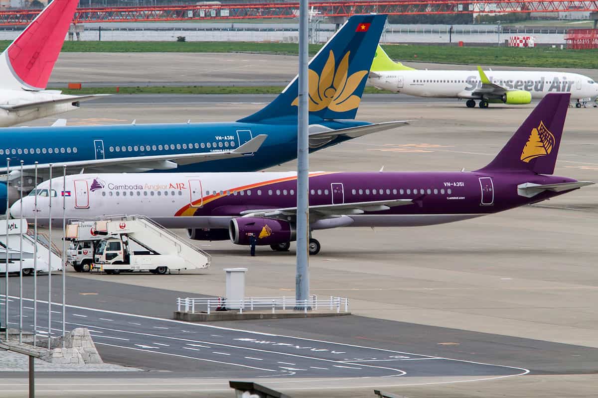 Phnom Penh To Sihanoukville: The 5 Best Ways To Travel 13 planes lined up at phnom penh international airport
