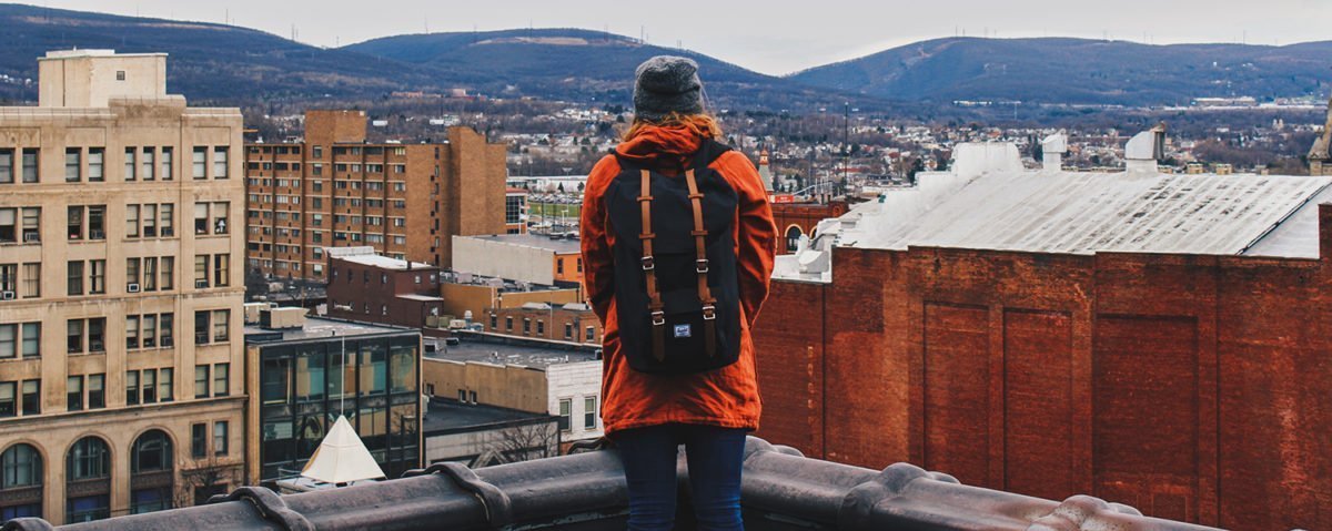 Backpack Or Suitcase? The Age Old Travel Debate 3 orange-backpack-view