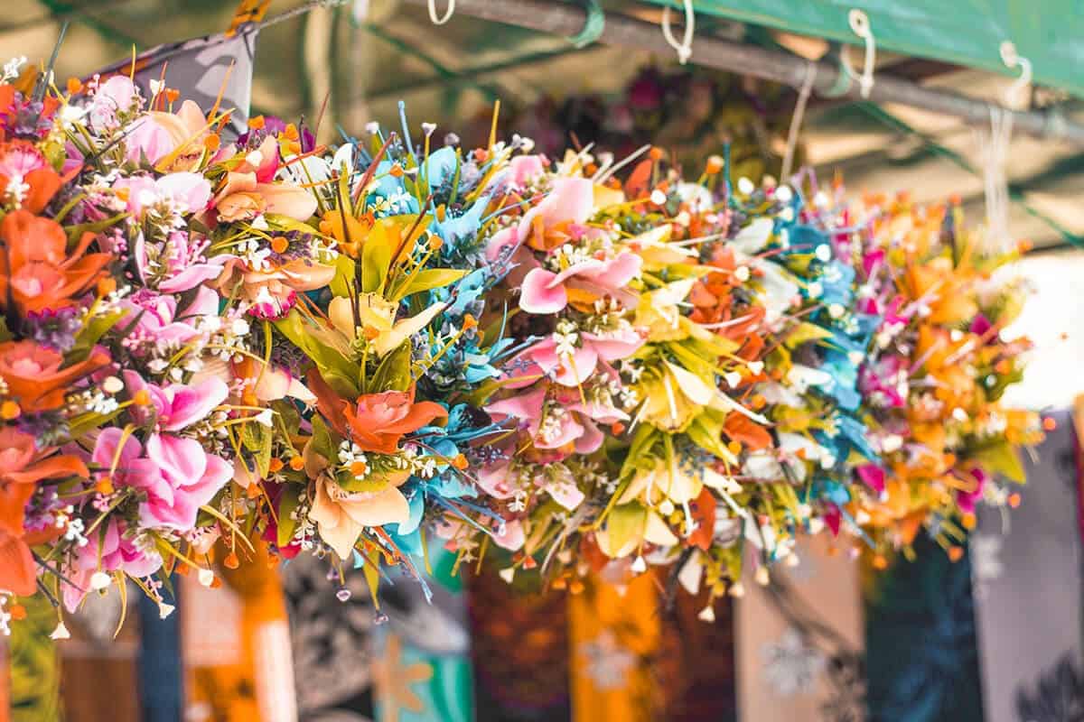 Punanga Nui Market: The Perfect Saturday Morning In Rarotonga 1 flower crowns hanging up at the punanga nui market in rarotonga