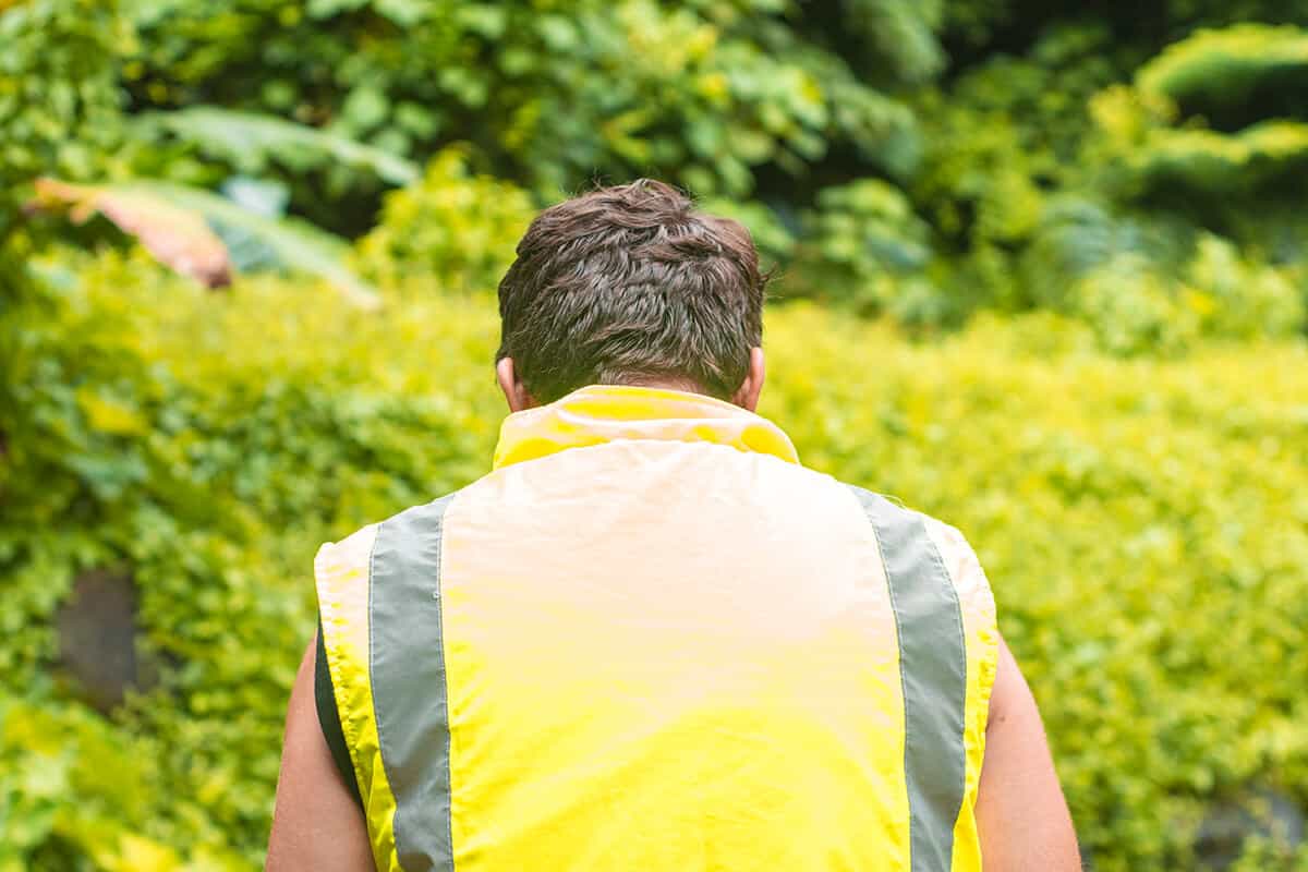 Quad Biking Rarotonga With Raro Quad Tours: Worth It? 12 man wearing high vis vest in the jungle