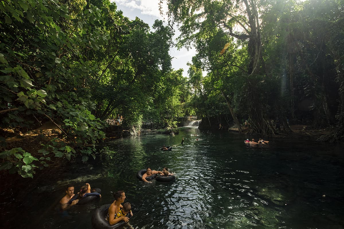 Rarru Cascades In Port Vila: BEST Tips For Visiting 2025 4 groups of people tubing alongside the river at the rarru cascades in port vila
