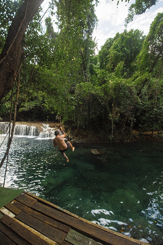 Rarru Cascades In Port Vila: BEST Tips For Visiting 2025 10 a man using a rope swing at rarru cascades