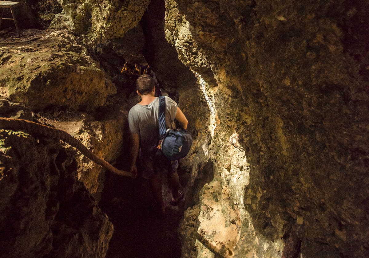 The Secret Grotto In Lifou: All You NEED To Know 2025 11 the tight pathway which opens up to the secret grotto in lifou