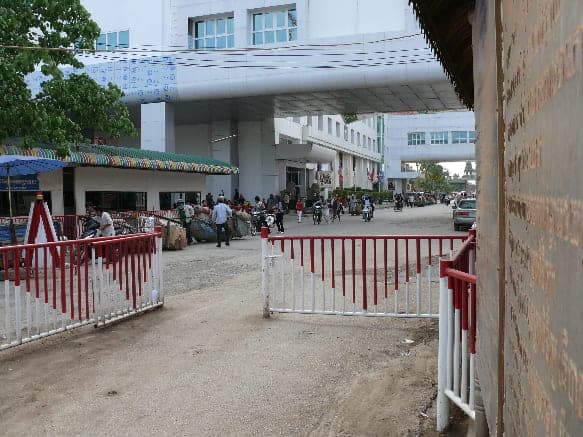 Siem Reap To Bangkok: The 4 BEST Ways To Travel 6 walking between buildings exiting cambodia