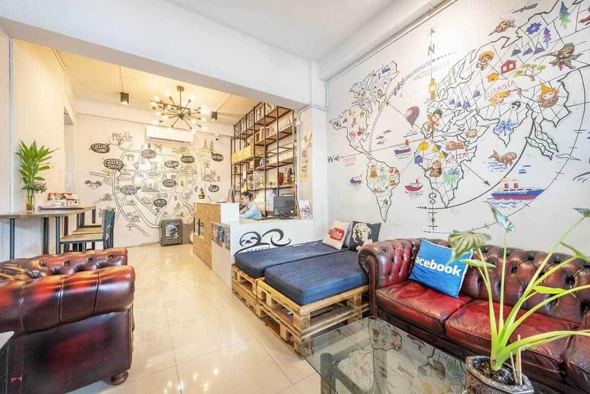 17 BEST Hostels On Khao San Road For Travelers! (2025) 12 sloth hostel khao san road common room and reception area