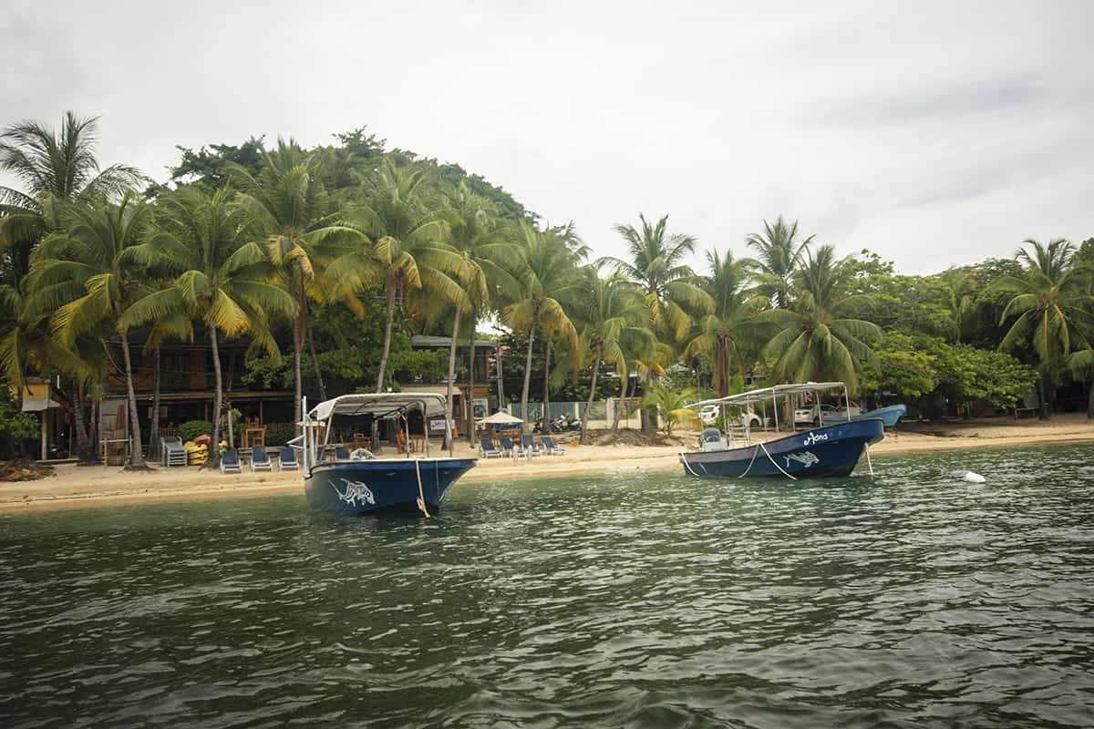 Snorkel The Blue Channel In Roatan: The Best Spot For Snorkeling 28 looking back at the shoreline at half moon bay in roatan