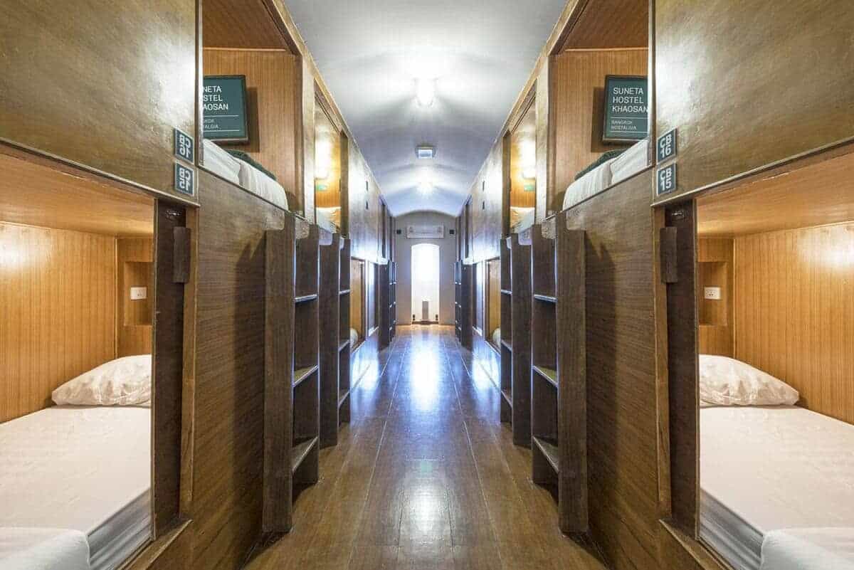 17 BEST Hostels On Khao San Road For Travelers! (2025) 18 suneta hostel dorm room with televisions