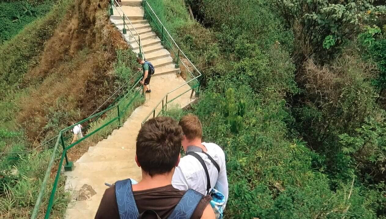 Tad Yuang Waterfall In Pakse: A Must Visit In Southern Laos 9 climbing down the staircase to tad yuang waterfall