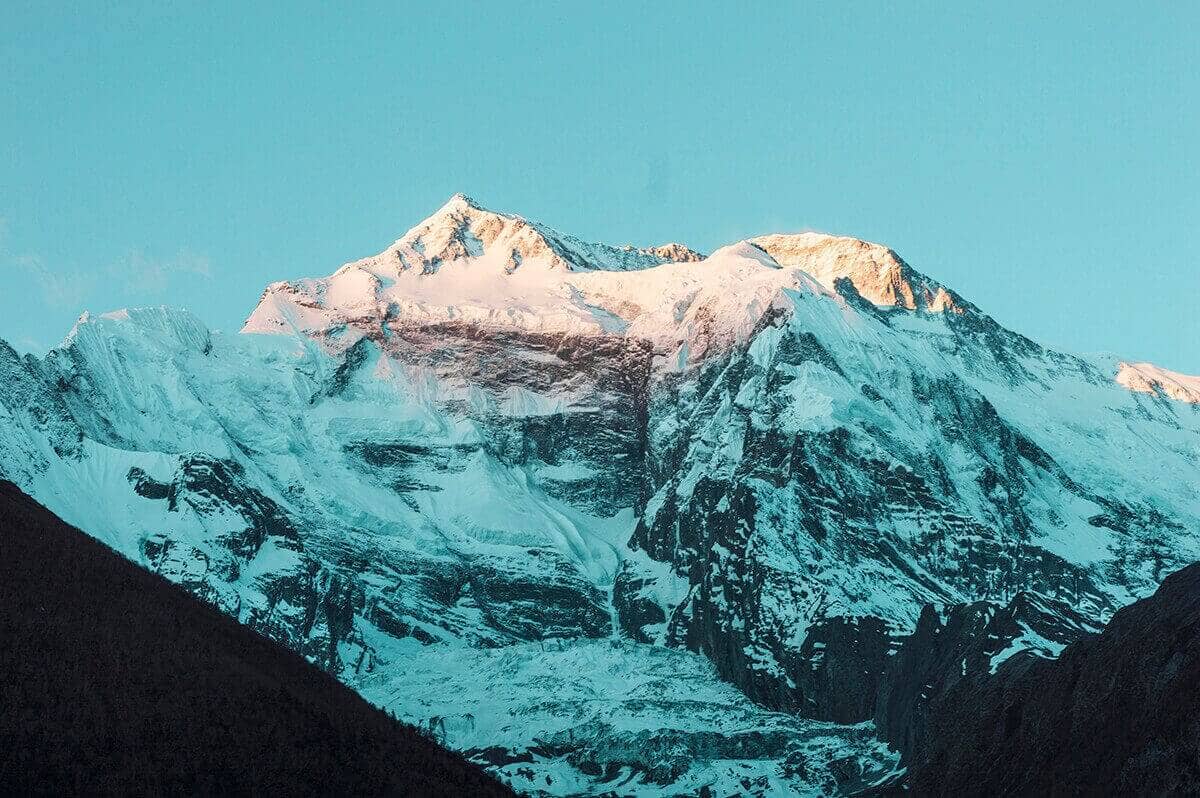 Day 6: Upper Pisang To Ngawal On The Annapurna Circuit 3 sun hitting mountain upper pisang to ngawal on the annapurna circuit nepal