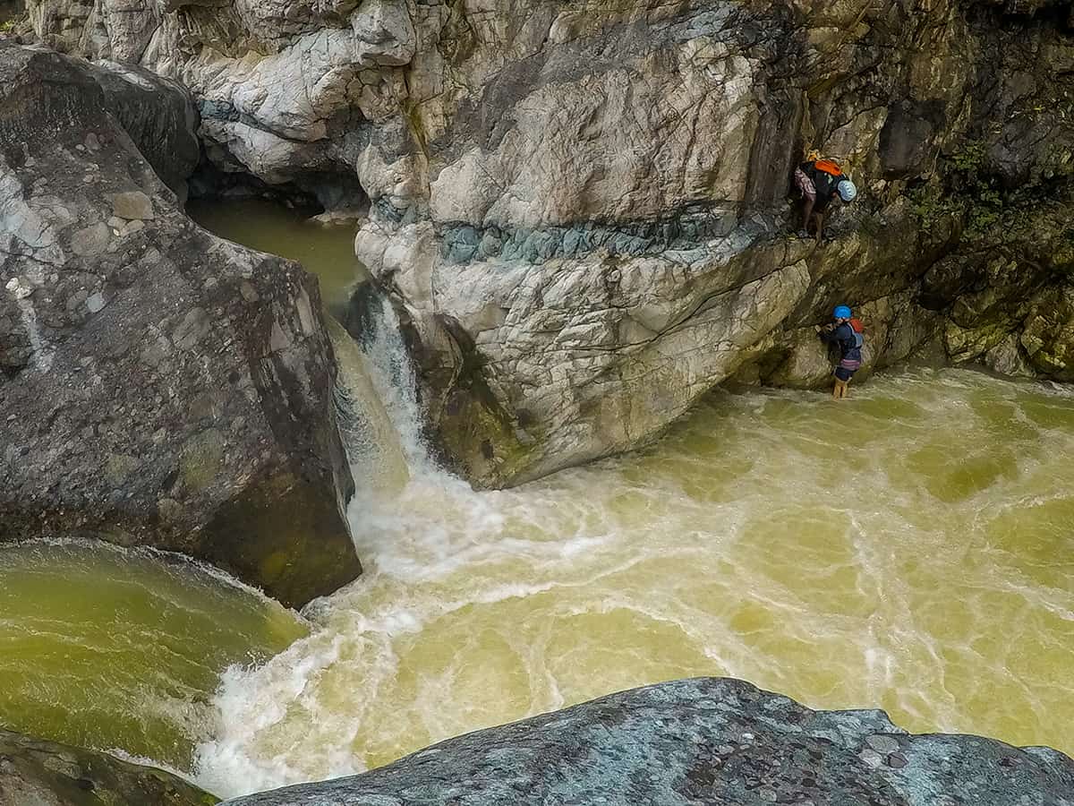 Best White Water Rafting In La Ceiba, Honduras: All You Need To Know 15 gushing waterfalls while on guide and a traveler climb up to the highest jumping point