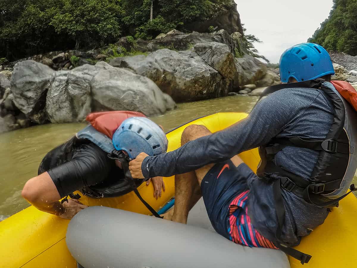 Best White Water Rafting In La Ceiba, Honduras: All You Need To Know 25 getting pulled back in the raft after going overboard on one of the rapids