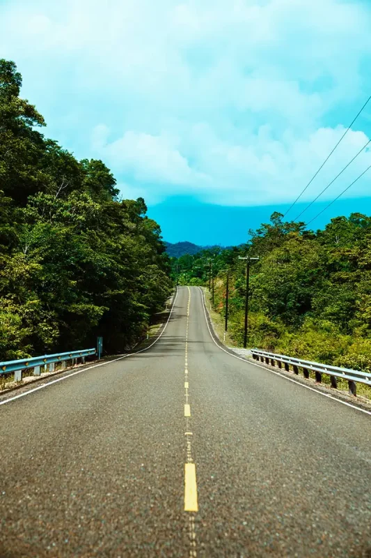 1 Week In Belize Itinerary: BEST 7 Days In Belize 28 looking down one of the roads in belize connecting belize city with san ignacio