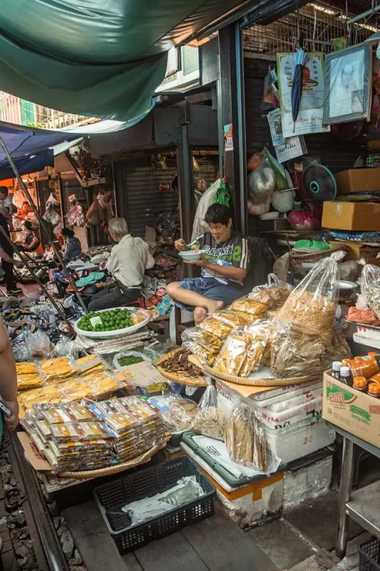 2 Days In Bangkok Itinerary: The ULTIMATE Guide 2025 16 the stalls at the railway market in bangkok selling all sorts of goods