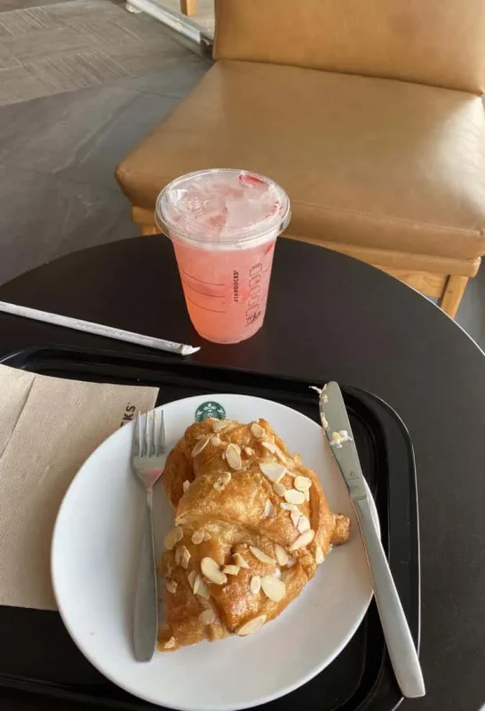 2 Days In Bangkok Itinerary: The ULTIMATE Guide 2025 14 a almond crossiant and strawberry acai refresher from starbucks for breakfast in bangkok