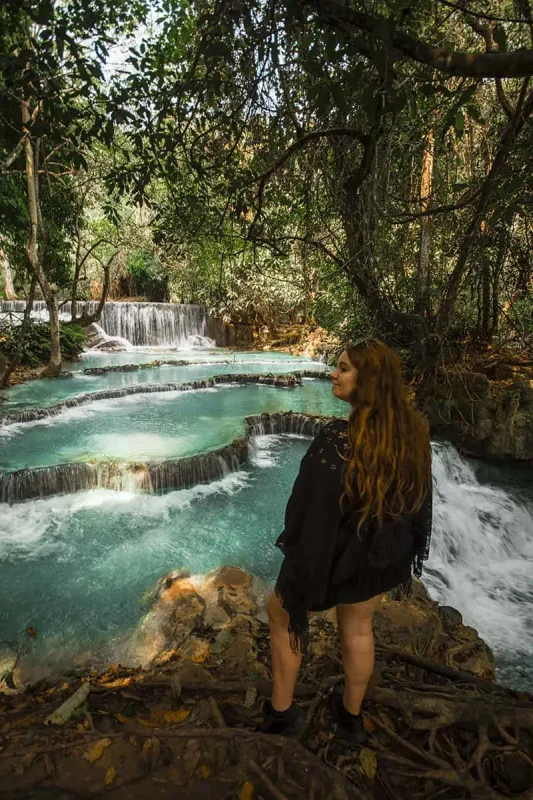 2 Weeks In Laos Itinerary: BEST Route North To South 12 tasha amy standing infront of the lower pools at kuang si falls in luang prabang on the backpacking laos itinerary