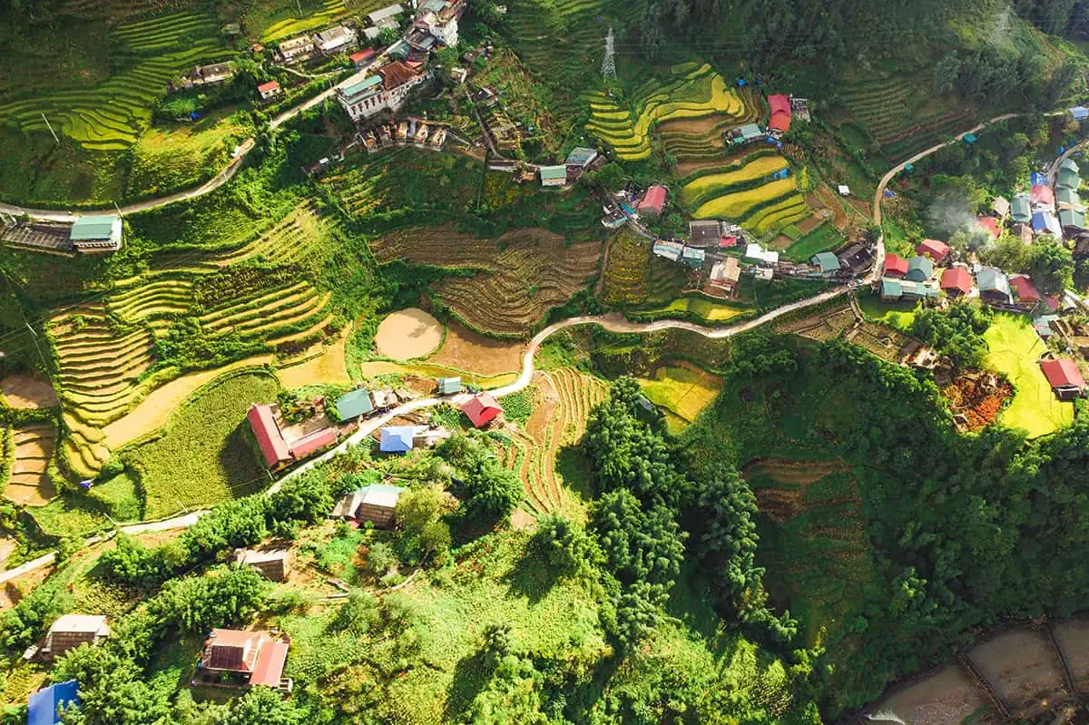 3 Week Vietnam Itinerary: BEST North To South Route 11 Aerial view of terraced rice fields in Sapa, a rural landscape that's a staple in a Vietnam itinerary 3 weeks.