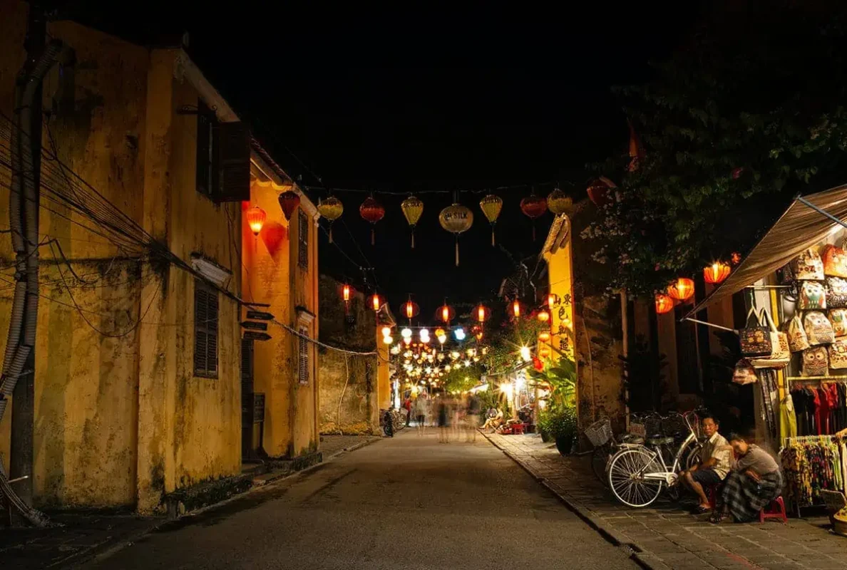 3 Week Vietnam Itinerary: BEST North To South Route 34 Night view of Hoi An Ancient Town with illuminated lanterns, a magical experience during 3 weeks in Vietnam.