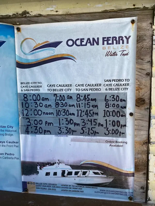 ATMs In Caye Caulker: Locations, Accepted Cards & All Money Matters 12 ocean ferry sign in caye caulker showing the ferry routes and times