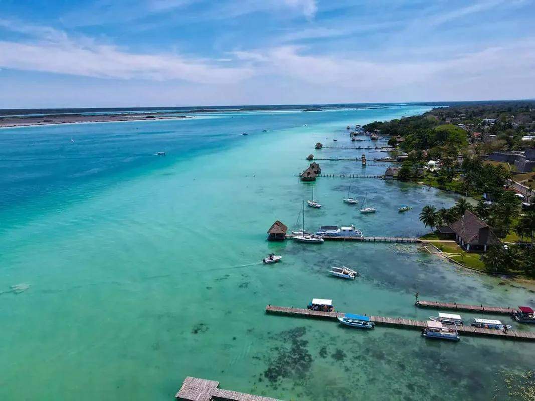 Bacalar To Caye Caulker: The ULTIMATE Travel Guide 2025 1 Aerial view of Bacalar's lagoon with clear waters stretching into the distance. Your starting point on the bacalar to caye caulker journey.