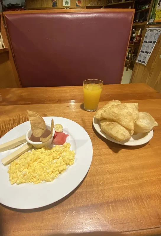 Backpacking Belize: The BEST Guide For Travelers 2025 19 a delicious typical breakfast in belize consisting of fry jacks, beans, and eggs