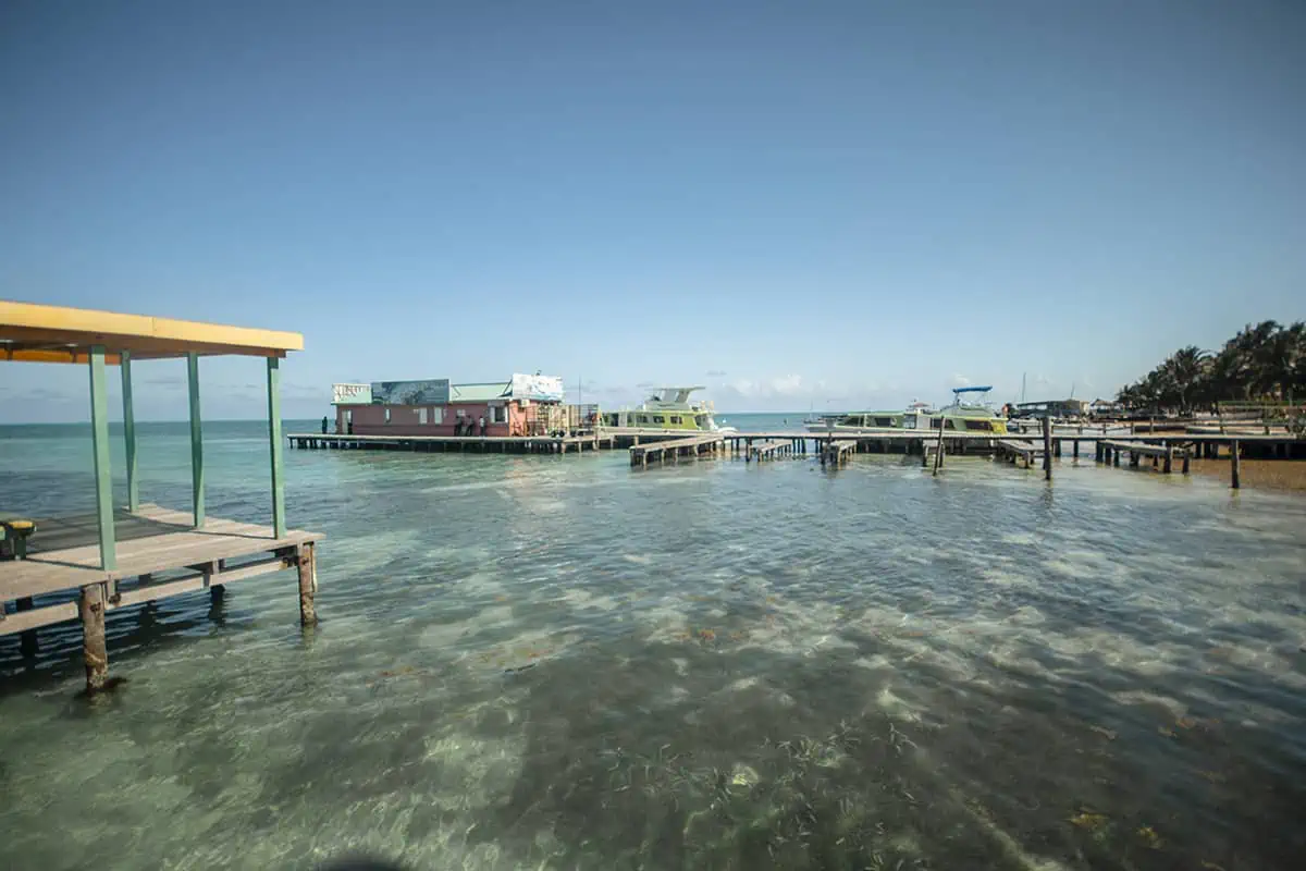 Backpacking Belize: The BEST Guide For Travelers 2025 4 incredible views from a pier in caye caulker while backpacking belize on a budget