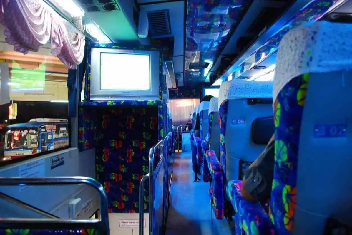 Bangkok To Chiang Mai: Bus, Train, Or Fly? 11 inside a double decker sleeper bus in bangkok