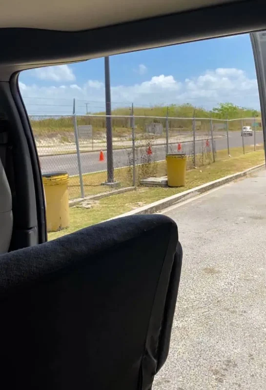 View from inside a vehicle showing a glimpse of the immigration at the belize mexico border