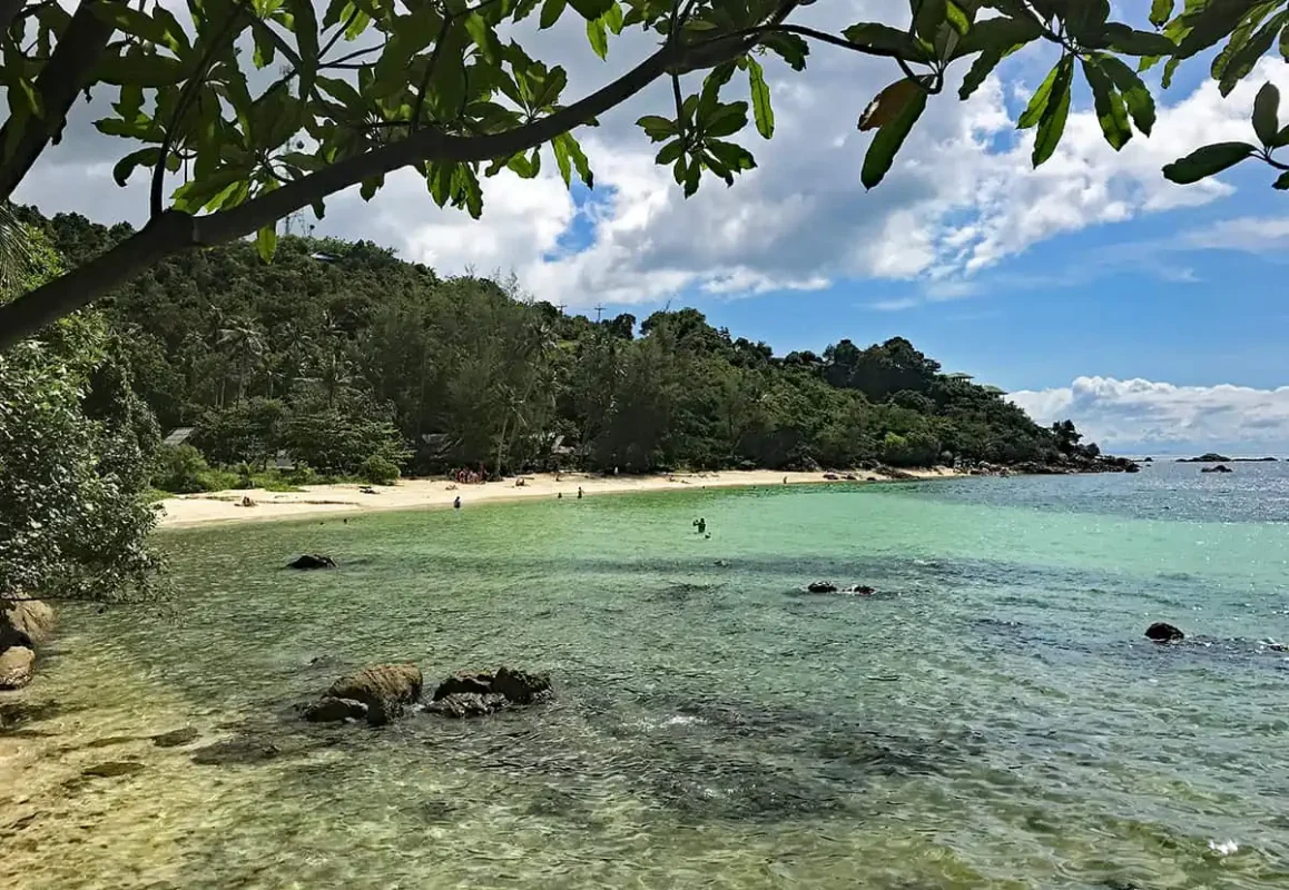 a sandy beach between the reef at haad son beach in koh phangan