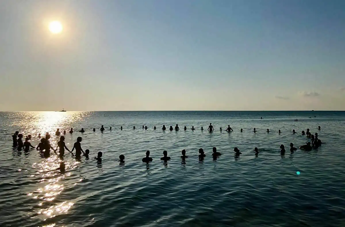 watching a meditation circle in the ocean at zen beach koh phangan