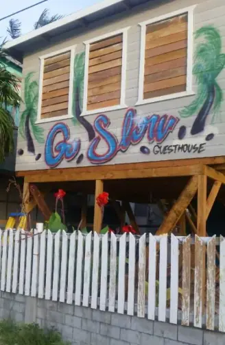 outside the building of the go slow guesthouse, the best hostel in caye caulker