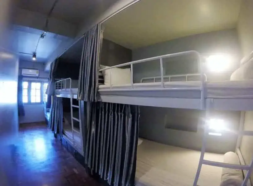 21 Best Hostels In Chiang Mai: Find Your Budget Stay 2025 9 the dorm rooms at august hostel in chiang mai with curtains for privacy