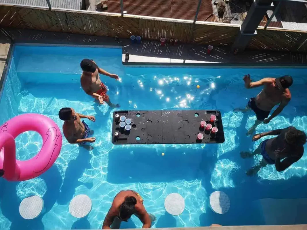 The 8 BEST Hostels In Lake Atitlan: My Favorites (2025) 18 beer pong in the pool at the social dreamboat hostel in panajachel