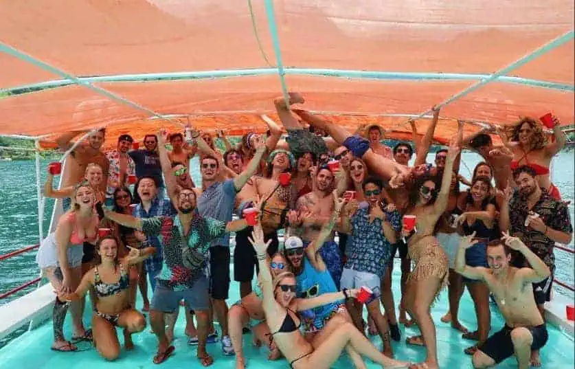 The 8 BEST Hostels In Lake Atitlan: My Favorites (2025) 9 boat party on lake atitlan with mr mullets hostel in san pedro la laguna