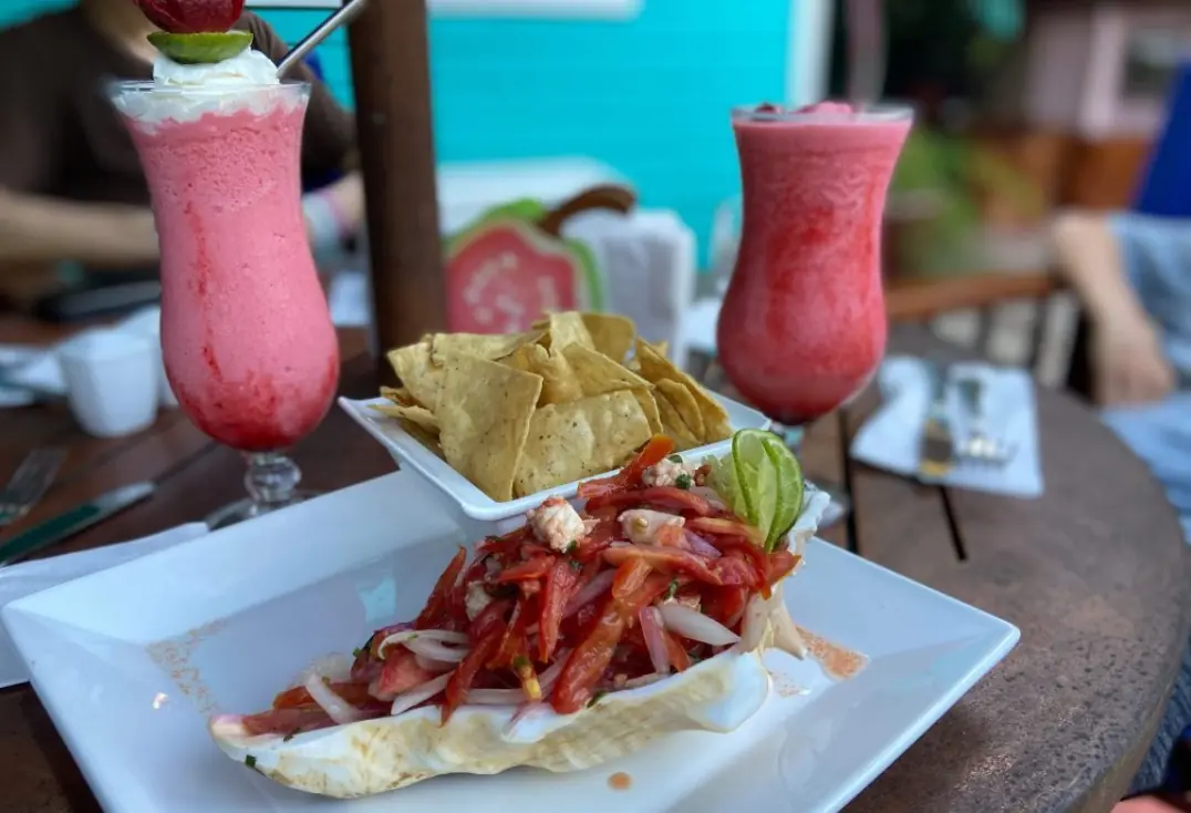 12 Best Restaurants In San Ignacio: Top Eats For Visitors 5 A refreshing pair of strawberry daiquiris accompany a plate of ceviche and tortilla chips, a popular choice at one of the best restaurants in san ignacio