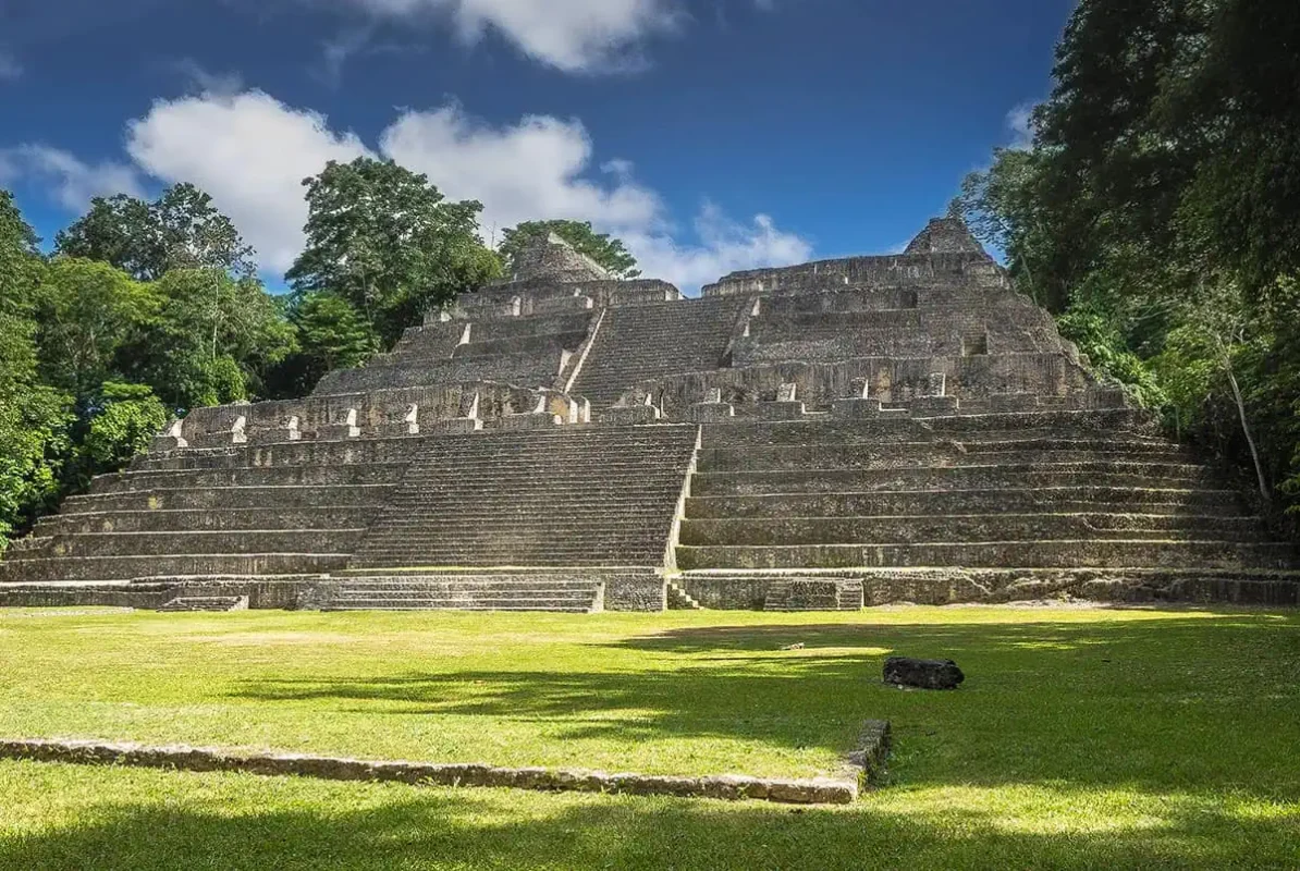 25+ Best Things To Do In San Ignacio, Belize (2025) 16 The grand pyramid of Caracol, an impressive Mayan ruin in San Ignacio, Belize. The pyramid features multiple terraces and steep steps, with dense forest greenery providing a striking backdrop against a clear blue sky