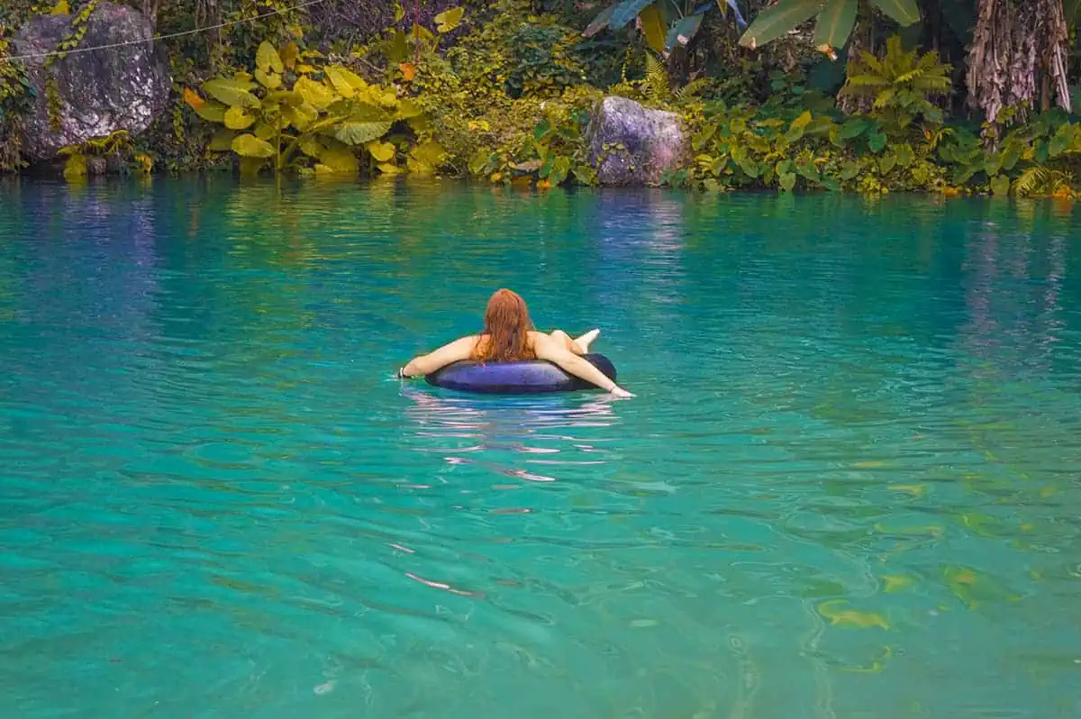 Blue Lagoon 3 In Vang Vieng: BEST Tips For Visiting 2025 5 floating around on a tube at the blue lagoons in vang vieng