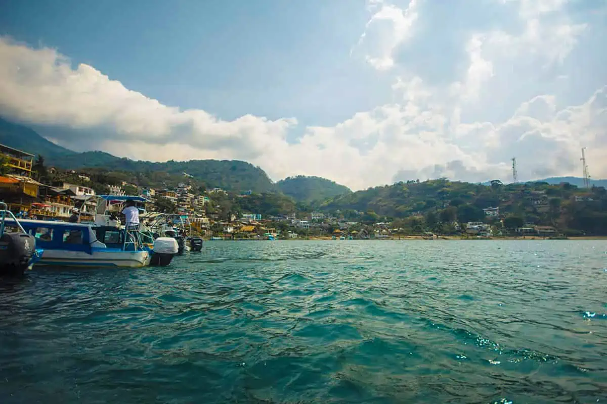 Can You Swim In Lake Atitlan Guatemala? The Water Quality, Sicknesses, & Sewage 8 the busy shoreline around san pedro la laguna