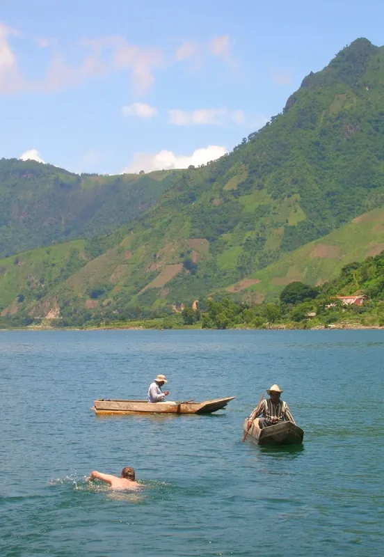 Can You Swim In Lake Atitlan Guatemala? The Water Quality, Sicknesses, & Sewage 10 swimming out to local fisherman on lake atitlan