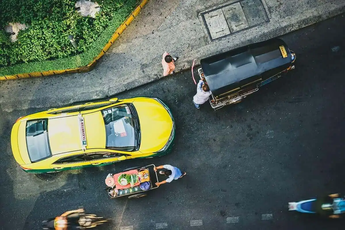 birds eye view of taxi driving in chiang mai traffic