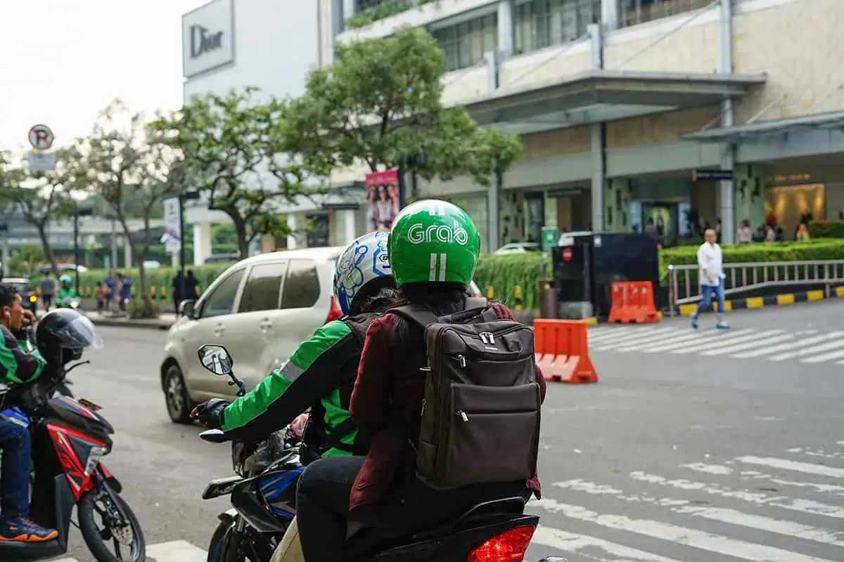 a grab motorbike with a passenger