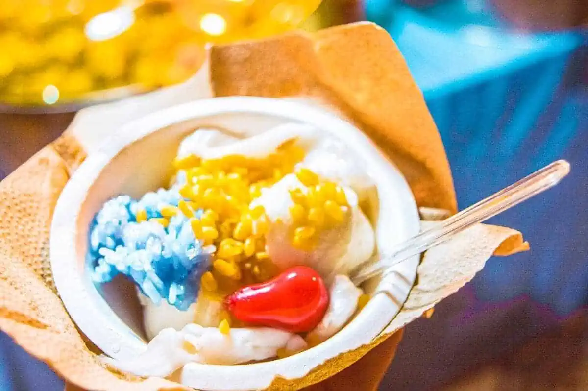 Chiang Mai Sunday Night Market: BEST Tips & Guide (2025) 18 coconut ice cream beautifully presented at a dessert stand.