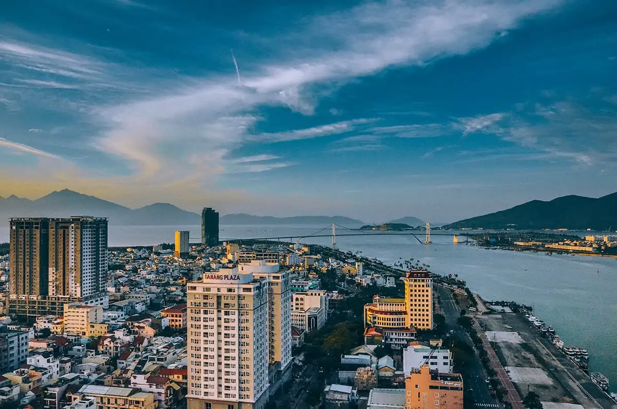 How To Travel From Da Nang To Hoi An 5 overlooking the city of da nang with large apartment buildings and a bridge over the river and out to sea