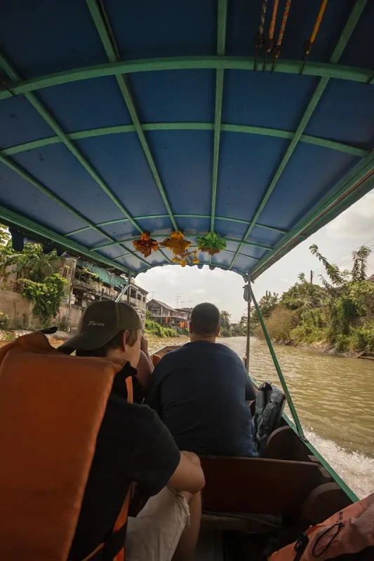 Ayutthaya Day Trip From Bangkok: BEST Guide (2025) 21 taking a boat through the canals on our ayutthaya day trip