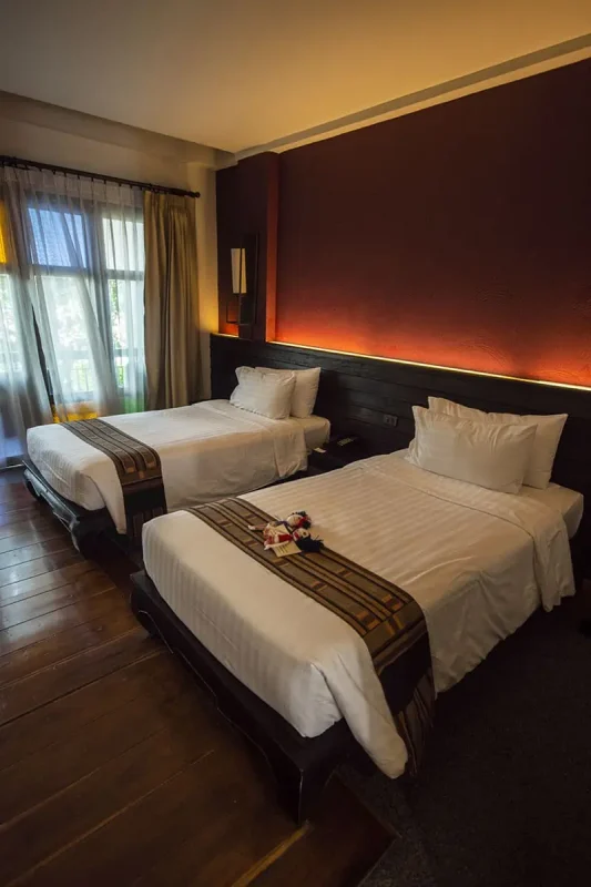 21 Best Hostels In Chiang Mai: Find Your Budget Stay 2025 14 twin bedroom at de lanna hotel