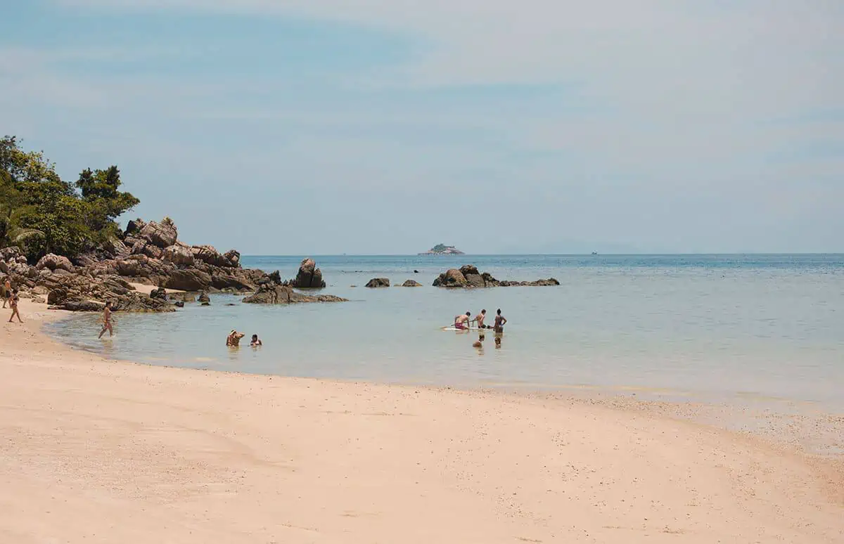tourists swimming at haad chao phao beach in koh phangan