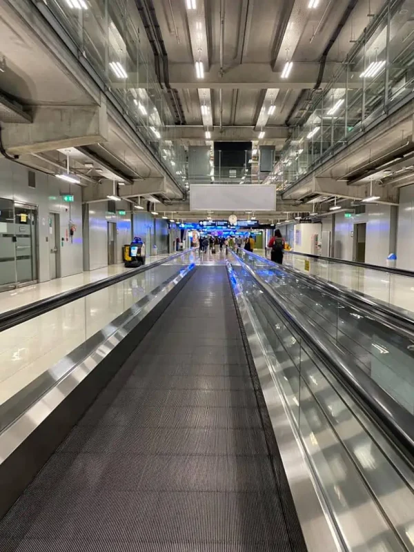 Khao San Road To Suvarnabhumi Airport: ULTIMATE Guide 8 taking the moving walkway toward immigration at suvarnabhumi airport in bangkok