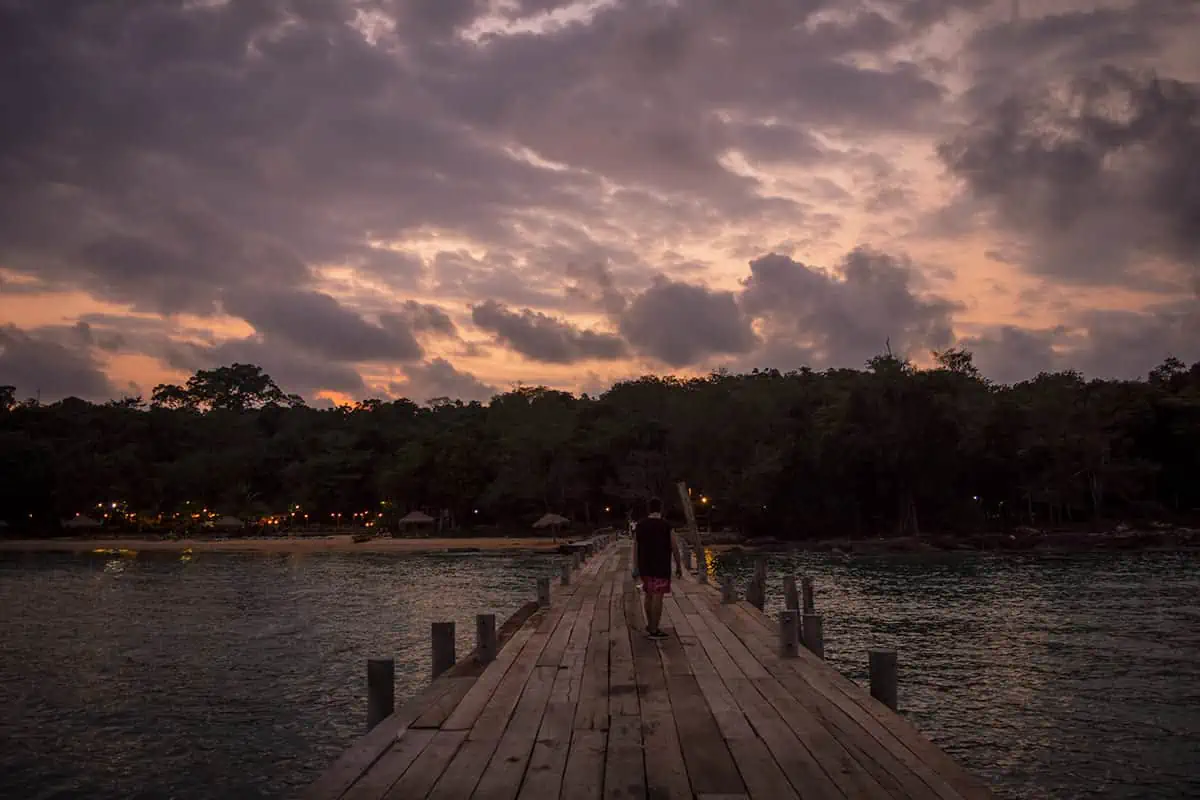 Koh Rong Or Koh Rong Samloem: Which Is BEST (2025) 35 walking back down the pier at sunset to our bungalow on koh rong