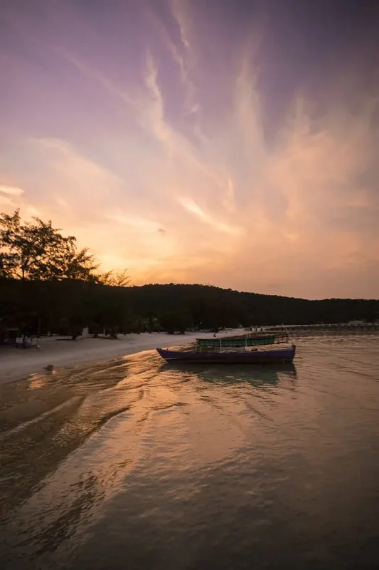 Koh Rong Or Koh Rong Samloem: Which Is BEST (2025) 34 a local boat at sunset in koh rong samloem