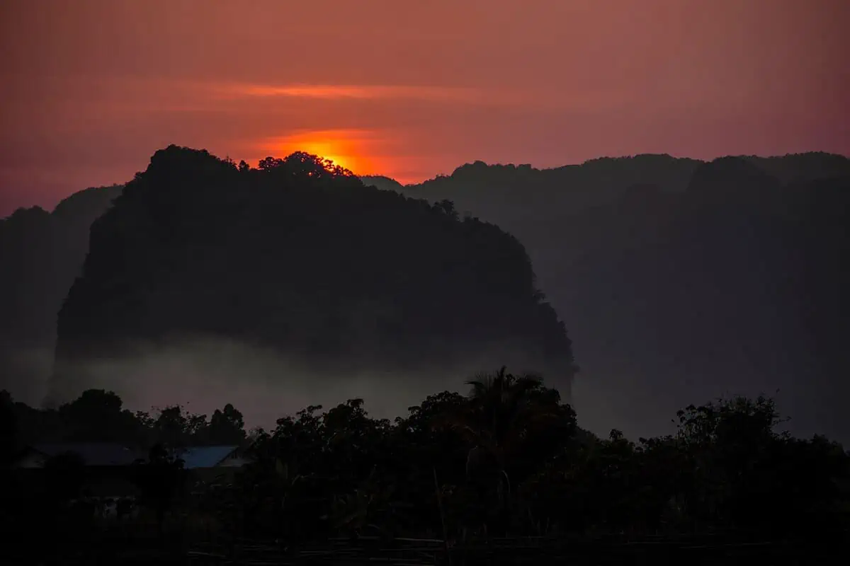 Kong Lor Cave, Laos: ULTIMATE Guide (2025) 22 sunset over the moutains in tham kong lo